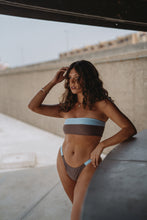 Load image into Gallery viewer, EONA Swimwear sustainable bandeau bikini top – model wearing shiny blue version